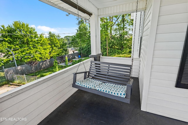 view of patio with fence and covered porch