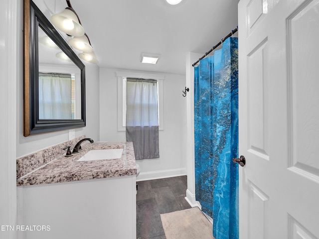 380 Buster Blvd, Lenoir City, TN 37772 - bathroom featuring baseboards, wood finished floors, and vanity
