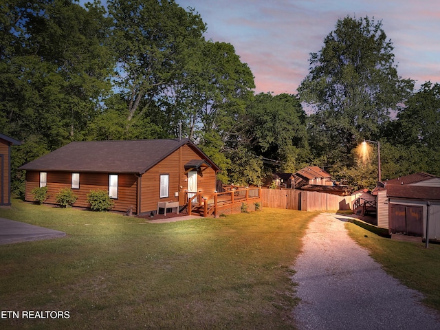380 Buster Blvd, Lenoir City, TN 37772 - exterior space with a lawn, fence, driveway, and an outdoor structure