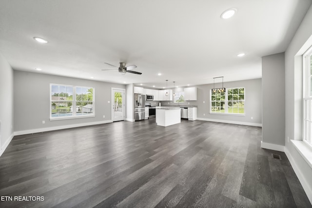 2934 Eledge Ln, Sevierville, TN 37876 - unfurnished living room with recessed lighting, baseboards, dark wood-style flooring, and ceiling fan