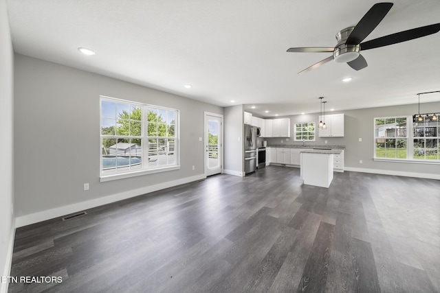 2934 Eledge Ln, Sevierville, TN 37876 - unfurnished living room featuring ceiling fan, recessed lighting, dark wood-style flooring, a sink, and baseboards