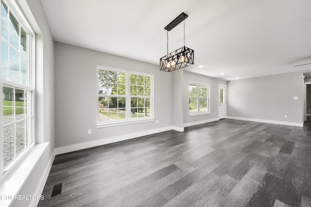 2934 Eledge Ln, Sevierville, TN 37876 - unfurnished living room with baseboards, dark wood finished floors, a chandelier, and recessed lighting