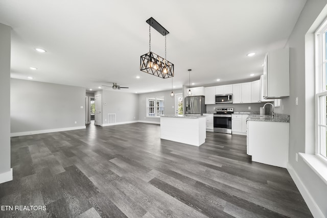 2934 Eledge Ln, Sevierville, TN 37876 - kitchen with appliances with stainless steel finishes, recessed lighting, open floor plan, baseboards, and a sink