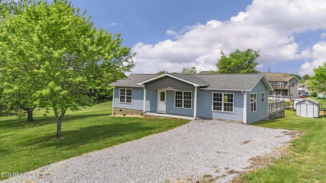 2934 Eledge Ln, Sevierville, TN 37876 - single story home featuring gravel driveway, a front yard, a porch, and crawl space