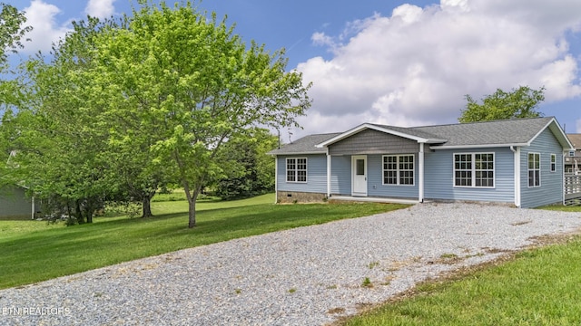 2934 Eledge Ln, Sevierville, TN 37876 - ranch-style house featuring gravel driveway, a front lawn, crawl space, roof with shingles, and covered porch