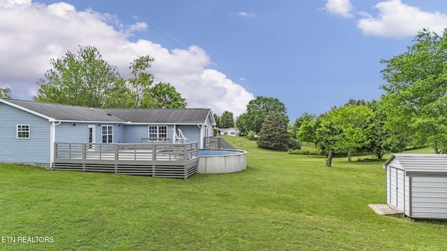 2934 Eledge Ln, Sevierville, TN 37876 - rear view of house featuring a wooden deck, a yard, and an outdoor pool