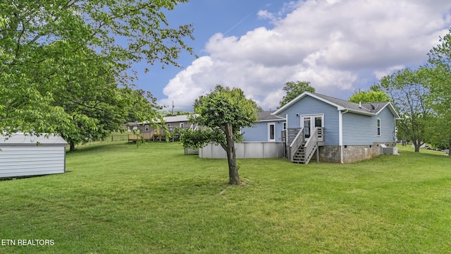 2934 Eledge Ln, Sevierville, TN 37876 - view of grassy yard featuring french doors and cooling unit
