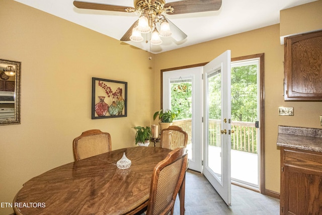 dining area featuring french doors, baseboards, and ceiling fan
