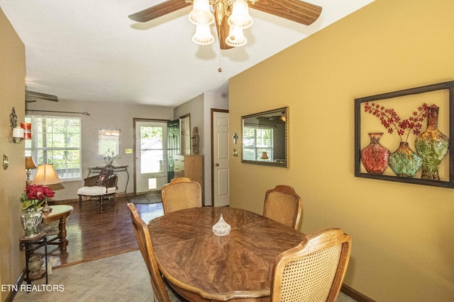 dining area featuring baseboards, ceiling fan, and wood finished floors
