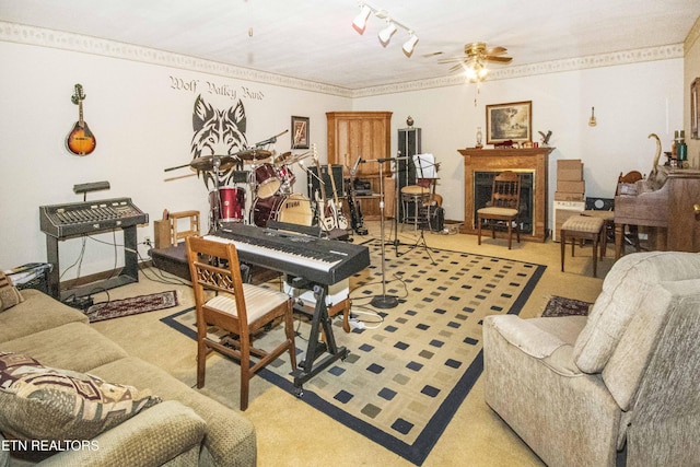 living room with carpet flooring, ceiling fan, and a fireplace
