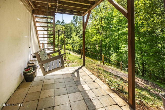 view of patio / terrace featuring a forest view