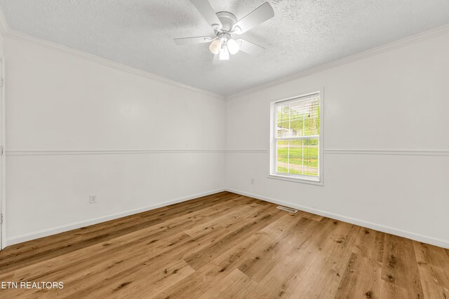2208 Island Blvd, Sevierville, TN 37876 - unfurnished room with wood finished floors, a textured ceiling, a ceiling fan, baseboards, and ornamental molding