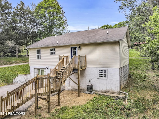 2208 Island Blvd, Sevierville, TN 37876 - rear view of house with stairs, a deck, central AC unit, and roof with shingles