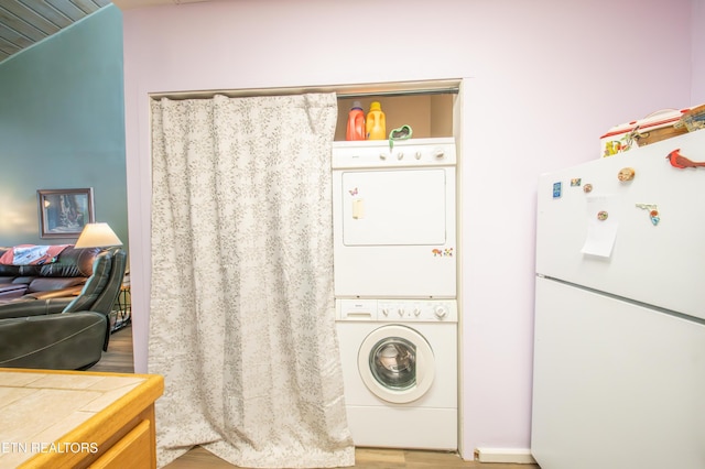 57 Eagle Ct, Crossville, TN 38558 - laundry area with stacked washer / dryer and wood finished floors