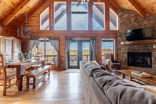 living room with high vaulted ceiling, beam ceiling, and wooden ceiling