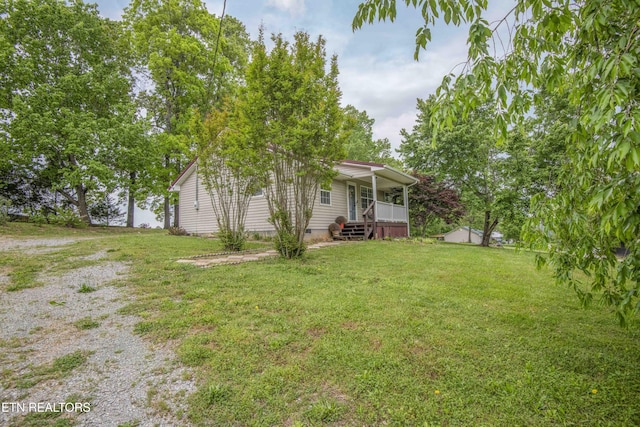 view of yard with covered porch