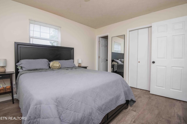 bedroom featuring a closet and wood finished floors