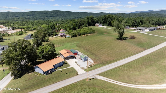 aerial view featuring a mountain view and a wooded view