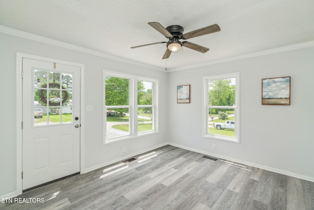 309 Evergreen St, Harriman, TN 37748 - interior space with visible vents, ornamental molding, wood finished floors, baseboards, and ceiling fan
