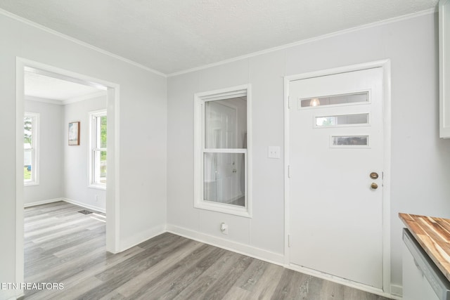 309 Evergreen St, Harriman, TN 37748 - foyer entrance featuring a textured ceiling, ornamental molding, baseboards, and light wood finished floors