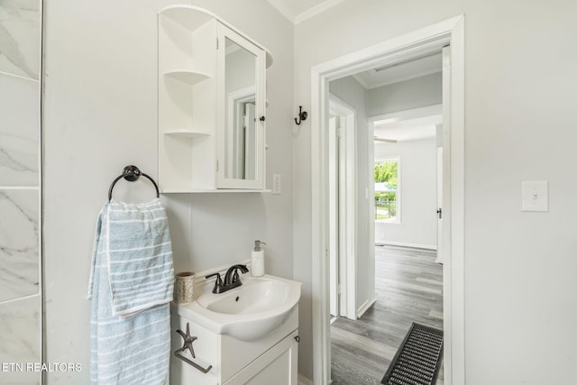 309 Evergreen St, Harriman, TN 37748 - bathroom featuring crown molding, wood finished floors, and vanity