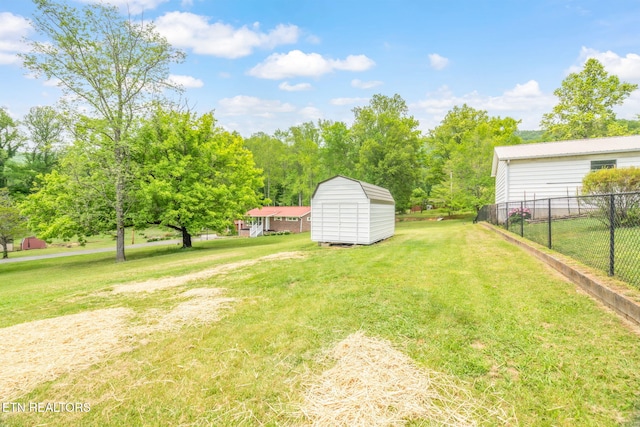 309 Evergreen St, Harriman, TN 37748 - view of yard with an outdoor structure, fence, and a storage shed