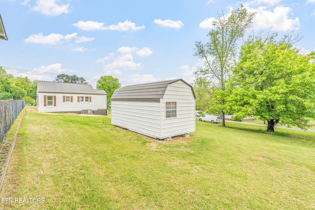 309 Evergreen St, Harriman, TN 37748 - view of yard with fence, an outbuilding, cooling unit, and a storage shed