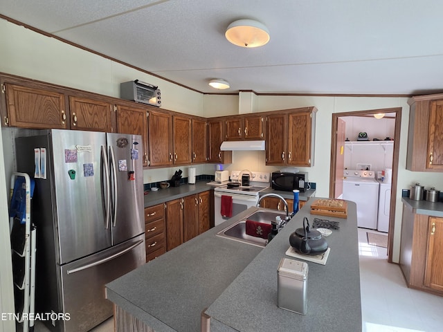 kitchen with freestanding refrigerator, black microwave, under cabinet range hood, white electric stove, and independent washer and dryer