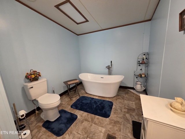 bathroom featuring crown molding, lofted ceiling, toilet, baseboards, and a soaking tub