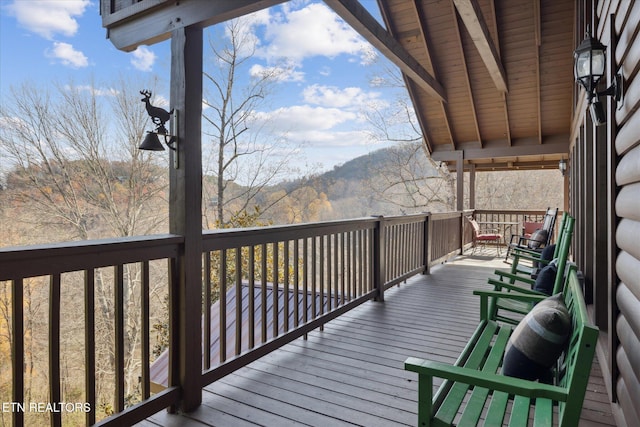 wooden terrace with a mountain view