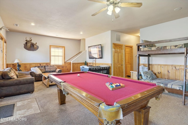 playroom featuring carpet floors, wainscoting, visible vents, and wooden walls