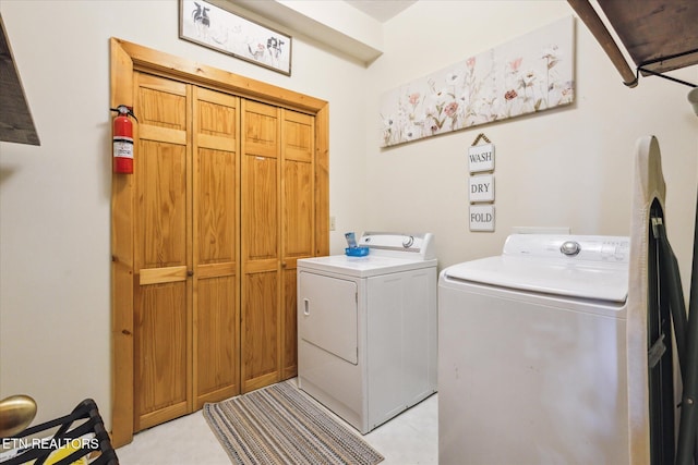 laundry room featuring cabinet space and washing machine and clothes dryer