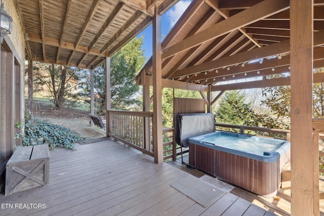 deck featuring a hot tub