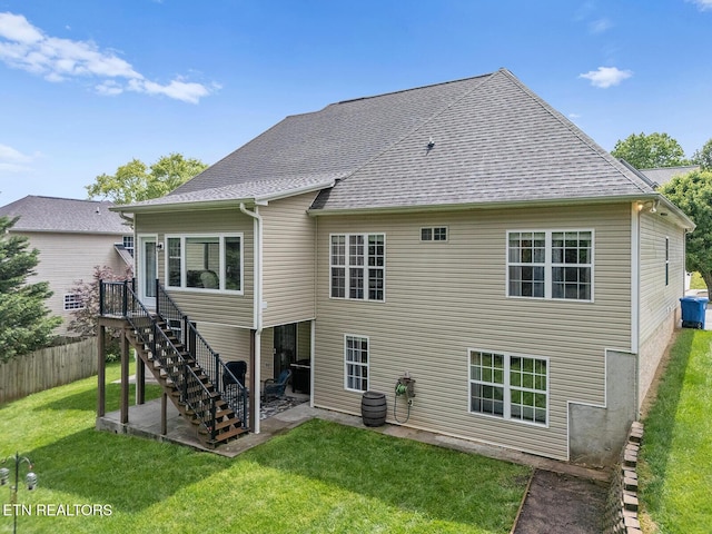 4322 Wellesley Dr, Ooltewah, TN 37363 - rear view of property featuring a lawn, stairway, fence, a patio, and a shingled roof
