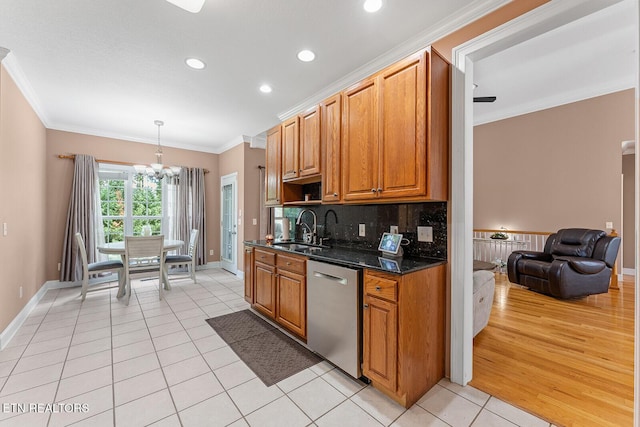 4322 Wellesley Dr, Ooltewah, TN 37363 - kitchen featuring dishwasher, a sink, light tile patterned floors, a chandelier, and ornamental molding