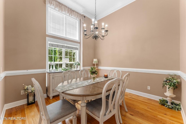 4322 Wellesley Dr, Ooltewah, TN 37363 - dining space with crown molding, baseboards, a chandelier, and light wood-style flooring
