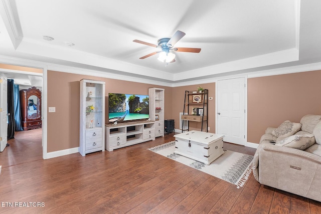 4322 Wellesley Dr, Ooltewah, TN 37363 - living room featuring a raised ceiling, baseboards, a ceiling fan, and wood finished floors