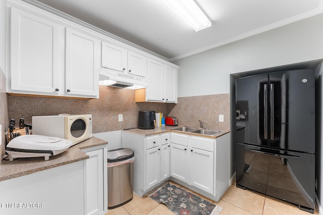 4322 Wellesley Dr, Ooltewah, TN 37363 - kitchen featuring freestanding refrigerator, ornamental molding, under cabinet range hood, a sink, and light tile patterned floors