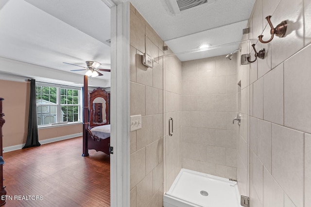4322 Wellesley Dr, Ooltewah, TN 37363 - bathroom with visible vents, wood finished floors, baseboards, ceiling fan, and a stall shower