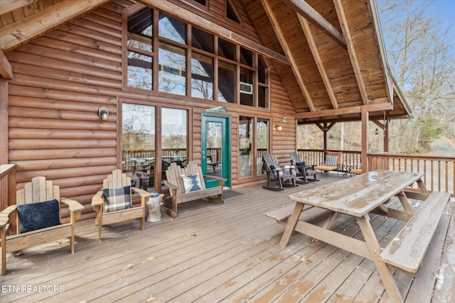 deck with outdoor dining area