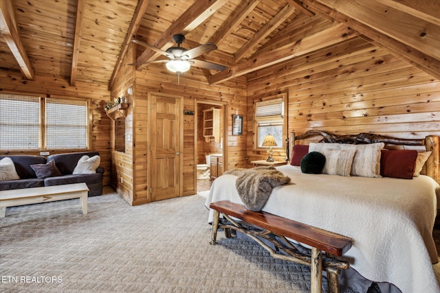 carpeted bedroom featuring wooden ceiling, vaulted ceiling with beams, ensuite bathroom, and wood walls