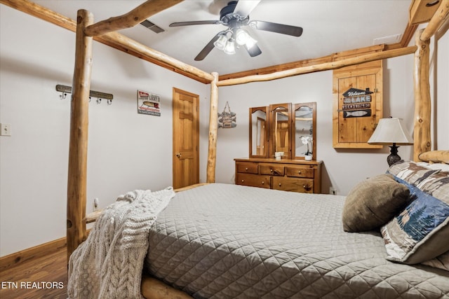 bedroom with visible vents, ceiling fan, and wood finished floors
