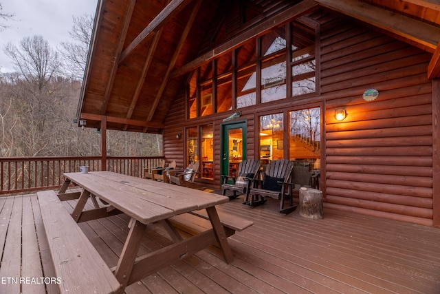 deck with outdoor dining area