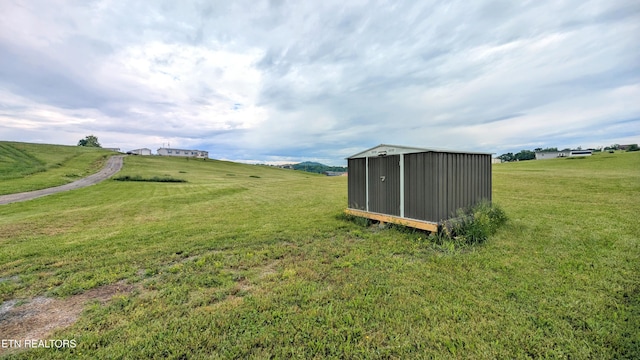 210 Schertz Ln, Rutledge, TN 37861 - view of yard with a storage unit, an outdoor structure, and a rural view