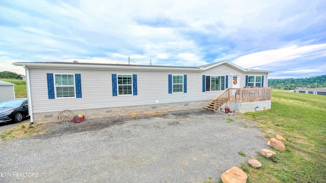 210 Schertz Ln, Rutledge, TN 37861 - manufactured / mobile home with a wooden deck, a front lawn, and crawl space