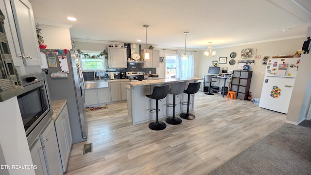 210 Schertz Ln, Rutledge, TN 37861 - kitchen with wall chimney range hood, decorative backsplash, a breakfast bar area, crown molding, and stainless steel appliances