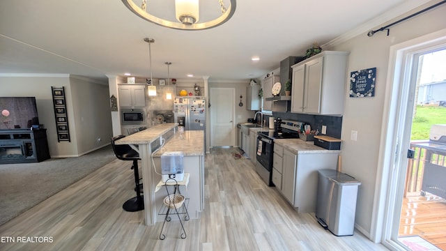 210 Schertz Ln, Rutledge, TN 37861 - kitchen featuring crown molding, appliances with stainless steel finishes, and a kitchen bar