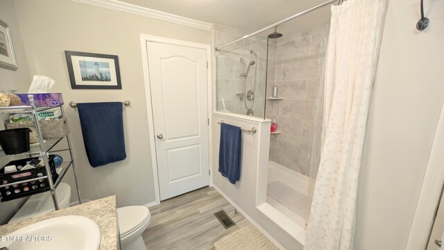210 Schertz Ln, Rutledge, TN 37861 - bathroom featuring crown molding, a sink, a shower stall, wood finished floors, and visible vents