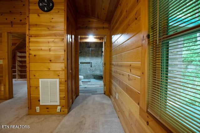 308 Black Mash Hollow Rd, Townsend, TN 37882 - corridor featuring lofted ceiling, wood walls, wood ceiling, and carpet floors