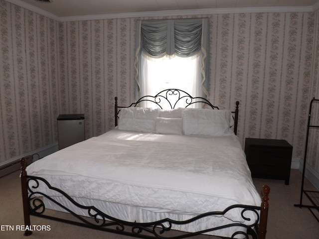 carpeted bedroom with crown molding and wallpapered walls